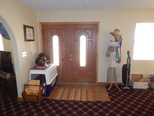 entrance foyer with a textured ceiling