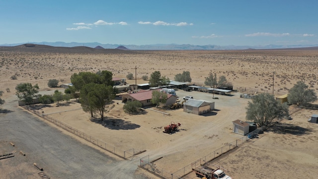 drone / aerial view featuring a mountain view and a rural view