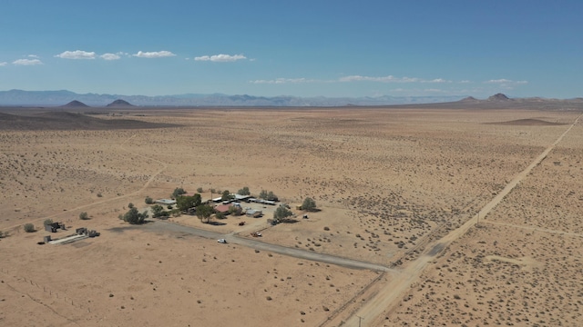 birds eye view of property featuring a mountain view