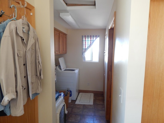 clothes washing area featuring cabinets and independent washer and dryer