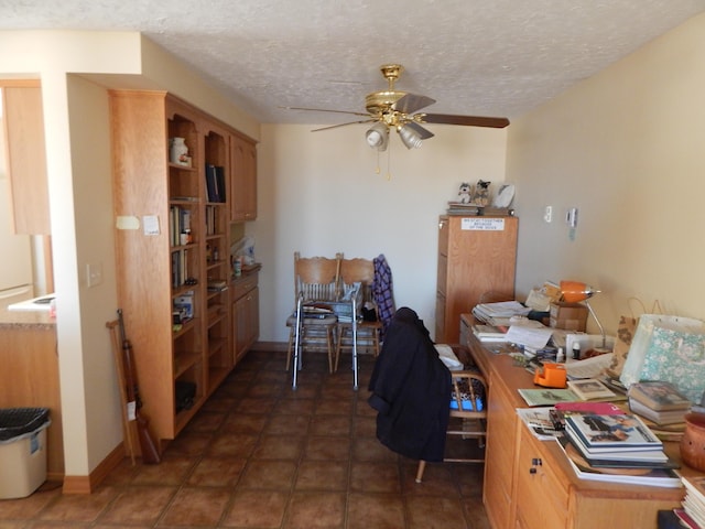 office space with ceiling fan and a textured ceiling