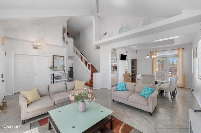 44559 Aspen St, Lancaster, CA 93535 - living room featuring a chandelier, light tile patterned floors, stairway, beamed ceiling, and high vaulted ceiling