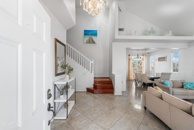 44559 Aspen St, Lancaster, CA 93535 - entrance foyer with a chandelier, stairs, high vaulted ceiling, and light tile patterned floors