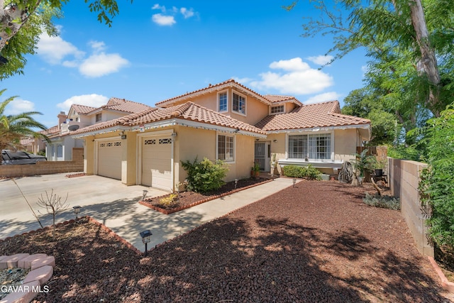 44559 Aspen St, Lancaster, CA 93535 - mediterranean / spanish-style home with stucco siding, a tile roof, a garage, and driveway