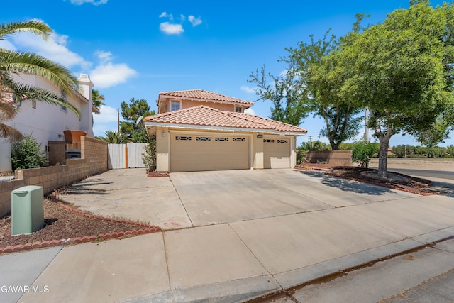 44559 Aspen St, Lancaster, CA 93535 - mediterranean / spanish-style home featuring a tiled roof, stucco siding, driveway, and an attached garage