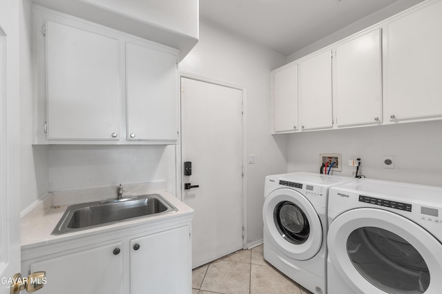 44559 Aspen St, Lancaster, CA 93535 - laundry area featuring cabinet space, washer and dryer, and light tile patterned flooring