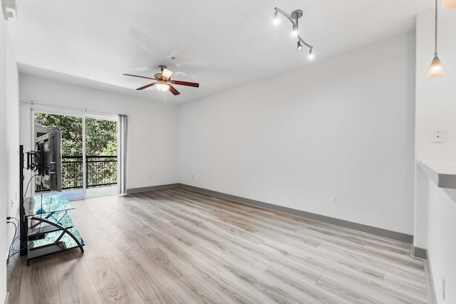 unfurnished living room with ceiling fan and light hardwood / wood-style floors