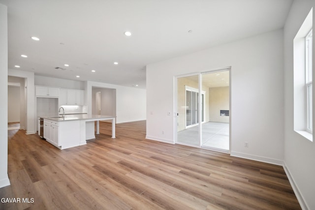 3716 Eliopulos Ranch Dr, Palmdale, CA 93551 - unfurnished living room featuring light wood-style floors and recessed lighting