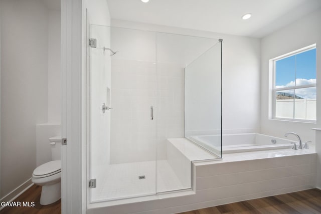 3716 Eliopulos Ranch Dr, Palmdale, CA 93551 - bathroom with a garden tub, wood finished floors, a stall shower, and recessed lighting