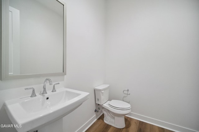 3716 Eliopulos Ranch Dr, Palmdale, CA 93551 - half bathroom with a sink and wood finished floors