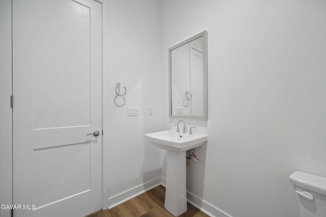 3716 Eliopulos Ranch Dr, Palmdale, CA 93551 - half bath featuring baseboards and wood finished floors