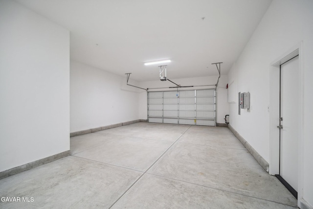 3716 Eliopulos Ranch Dr, Palmdale, CA 93551 - garage featuring baseboards and a garage door opener