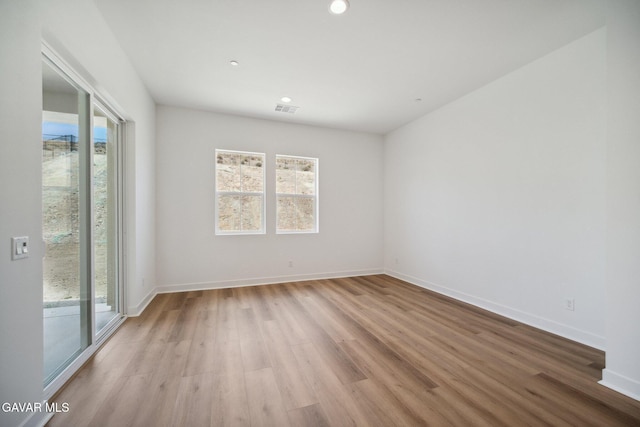 3716 Eliopulos Ranch Dr, Palmdale, CA 93551 - empty room with plenty of natural light, wood finished floors, and recessed lighting