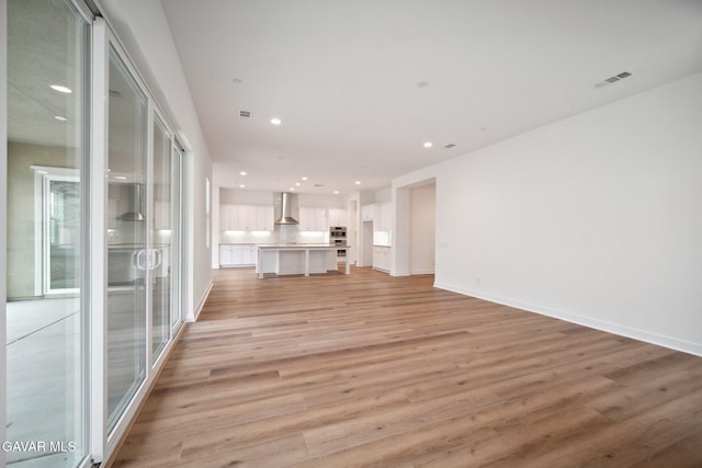 3716 Eliopulos Ranch Dr, Palmdale, CA 93551 - unfurnished living room featuring light wood finished floors and recessed lighting