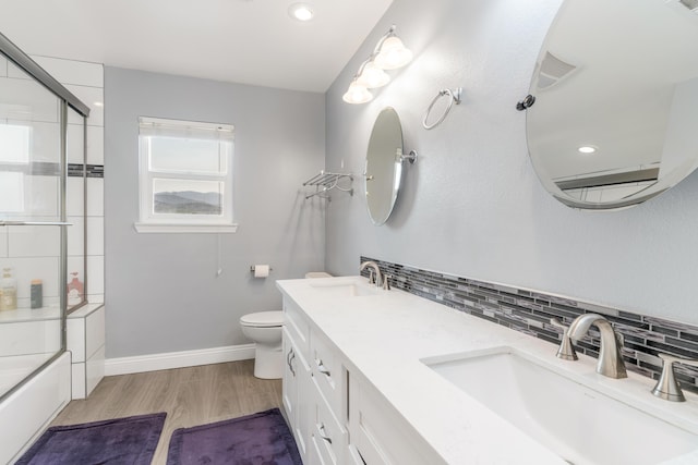 36755 Tierra Subida Ave, Palmdale, CA 93551 - full bathroom featuring tasteful backsplash, toilet, wood finished floors, baseboards, and enclosed tub / shower combo