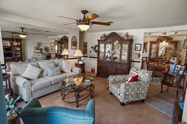 living room with a textured ceiling, ceiling fan, and carpet floors