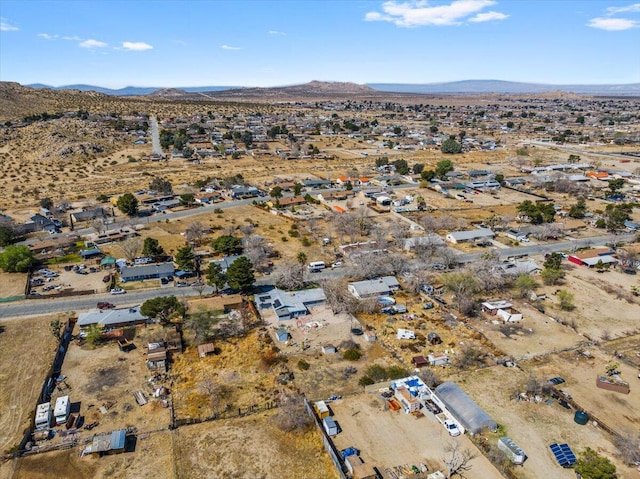 drone / aerial view with a mountain view and view of desert