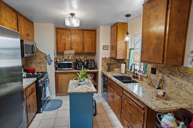 kitchen with light tile patterned floors, brown cabinetry, a sink, stainless steel appliances, and tasteful backsplash