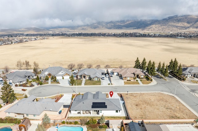 bird's eye view with a mountain view