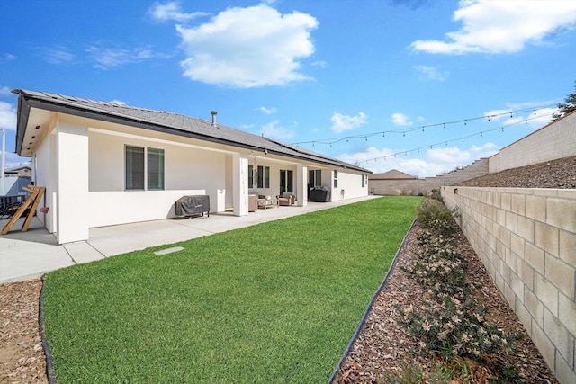 rear view of property with a patio area and a lawn