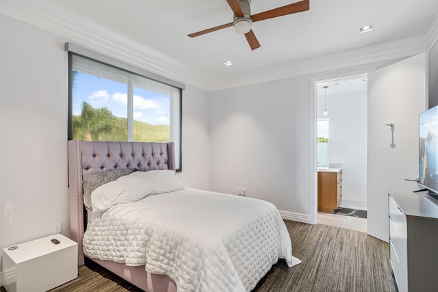 bedroom featuring ensuite bath, ceiling fan, hardwood / wood-style floors, and ornamental molding