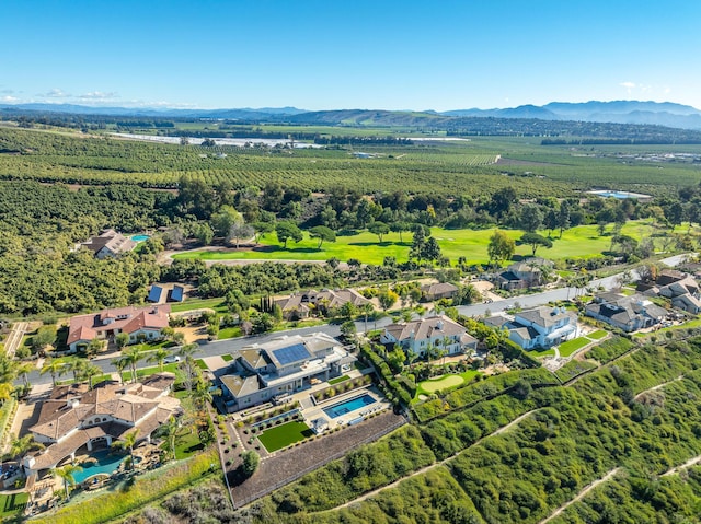 birds eye view of property with a mountain view