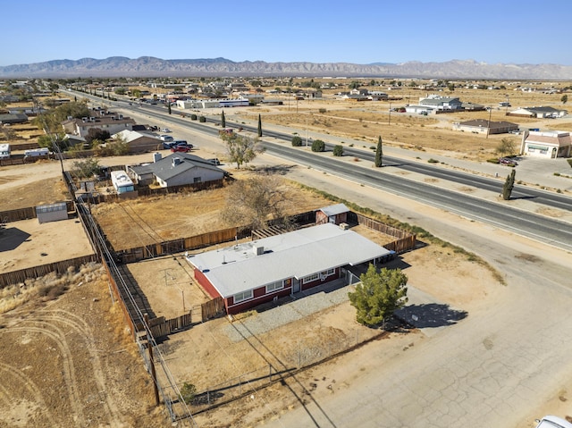 birds eye view of property with a mountain view