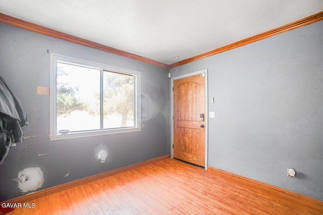 809 Berncastle Rd, Acton, CA 93510 - empty room with plenty of natural light, wood finished floors, and crown molding