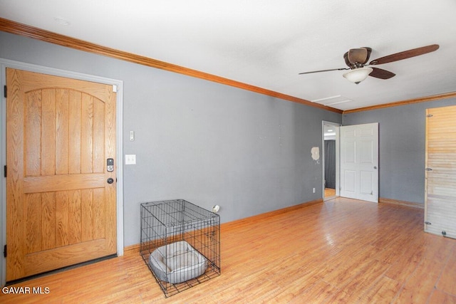 809 Berncastle Rd, Acton, CA 93510 - entrance foyer featuring wood finished floors, a ceiling fan, and crown molding