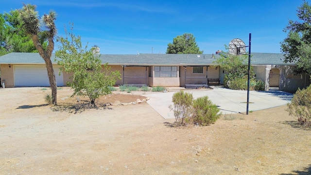 ranch-style house featuring a garage