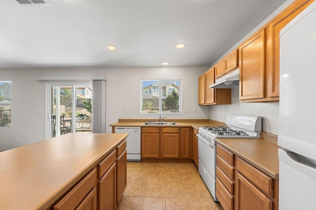 7150 Lyric Ave, Lancaster, CA 93536 - kitchen featuring white appliances, a sink, under cabinet range hood, recessed lighting, and light tile patterned flooring