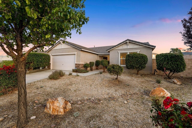 7150 Lyric Ave, Lancaster, CA 93536 - ranch-style house featuring stucco siding, an attached garage, driveway, and stone siding