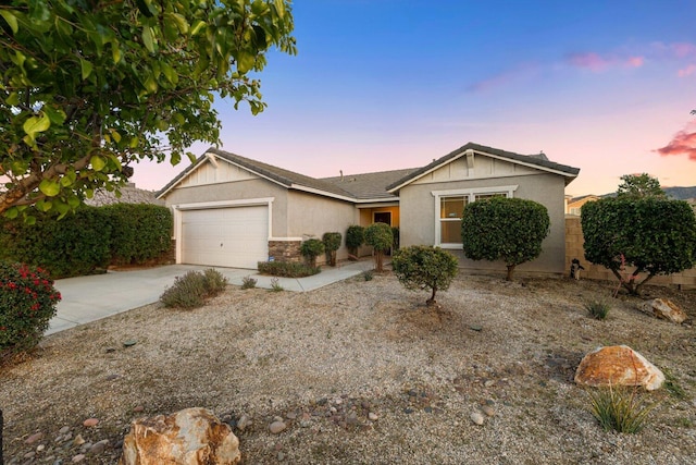 7150 Lyric Ave, Lancaster, CA 93536 - ranch-style home featuring stucco siding, concrete driveway, a garage, and stone siding