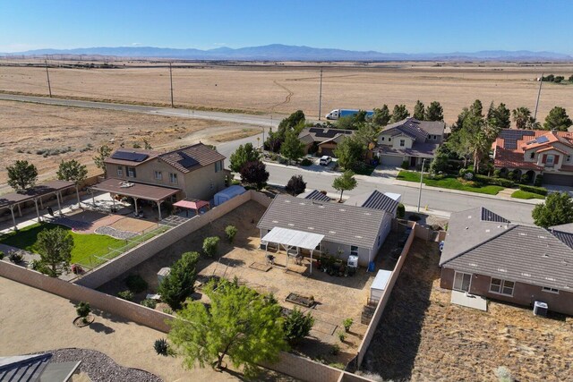 7150 Lyric Ave, Lancaster, CA 93536 - overview of rural landscape with a mountainous background and nearby suburban area