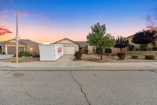 7150 Lyric Ave, Lancaster, CA 93536 - view of front facade with concrete driveway and an attached garage