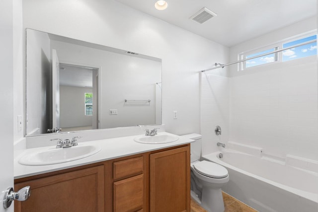 7150 Lyric Ave, Lancaster, CA 93536 - full bathroom with toilet, double vanity, and shower / tub combination