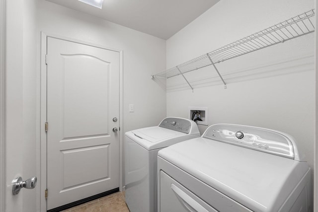 7150 Lyric Ave, Lancaster, CA 93536 - washroom featuring washing machine and clothes dryer and light tile patterned floors