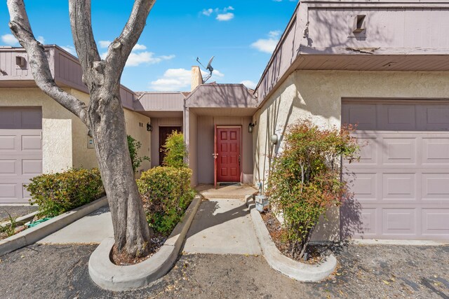 entrance to property with stucco siding