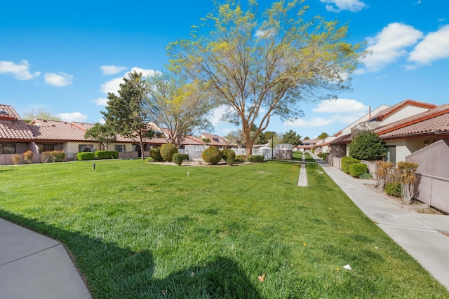 view of yard featuring a residential view and fence