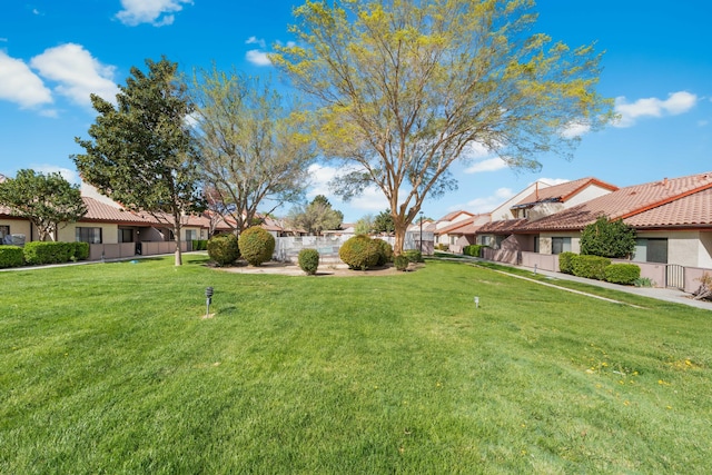 view of yard featuring a residential view and fence
