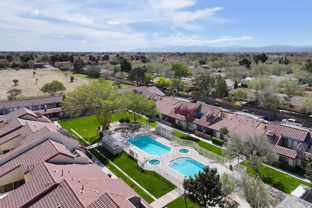 drone / aerial view featuring a residential view and a mountain view
