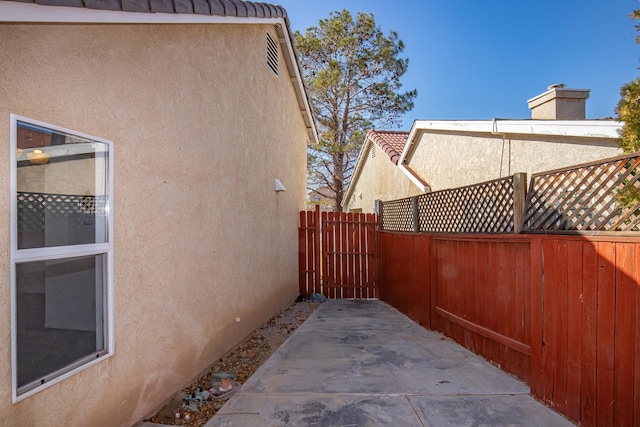 view of side of home featuring a patio area