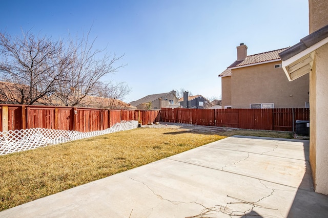 view of yard featuring cooling unit and a patio area