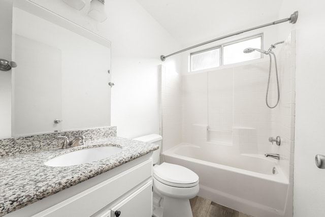 full bathroom with vanity, wood-type flooring, tub / shower combination, and toilet