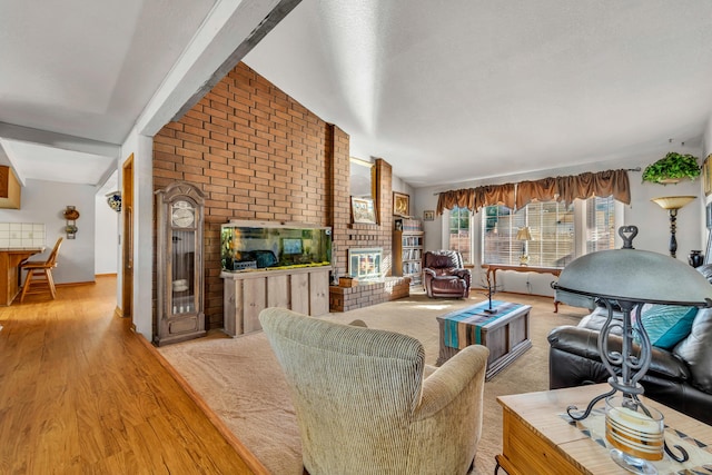 living room with lofted ceiling and light hardwood / wood-style floors