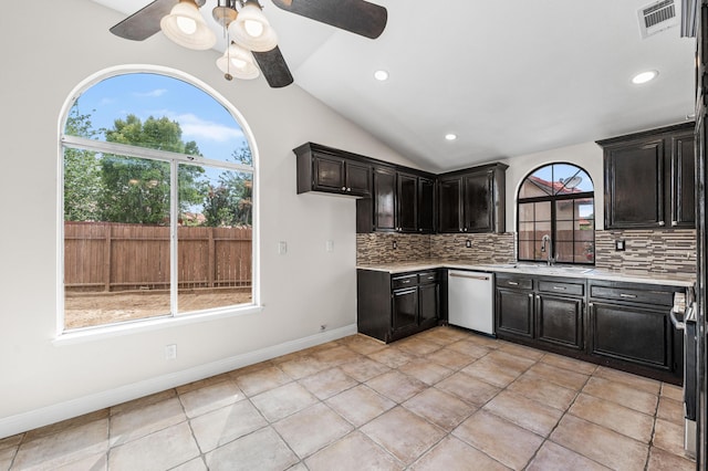kitchen featuring a sink, ceiling fan, tasteful backsplash, and dishwasher