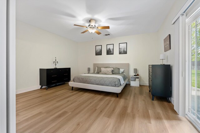 bedroom with light wood-style flooring, access to exterior, ceiling fan, and baseboards