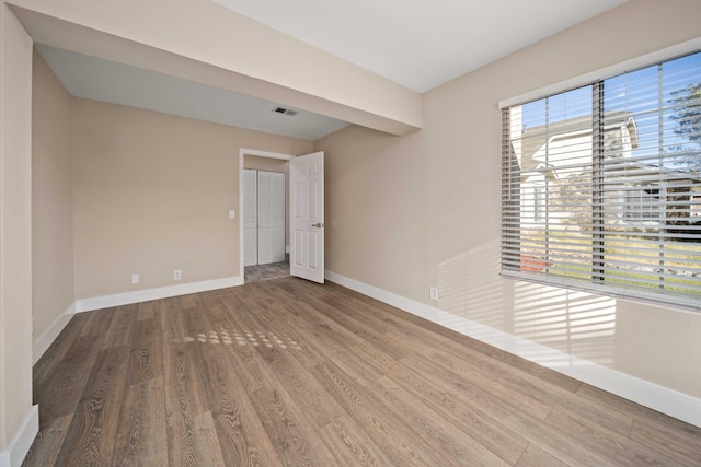 spare room featuring hardwood / wood-style floors