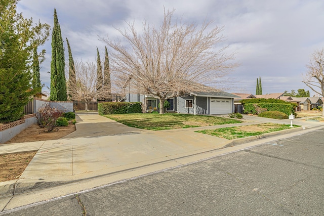 view of front of house featuring a garage, concrete driveway, and fence