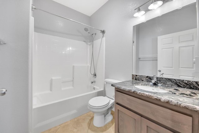 full bathroom featuring toilet, tile patterned flooring, vanity, and washtub / shower combination